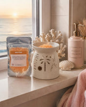 Load image into Gallery viewer, Fruity and sweet luxury scented sizzlers granules for home fragrance sitting next to a wax warmer on a clean kitchen bench.
